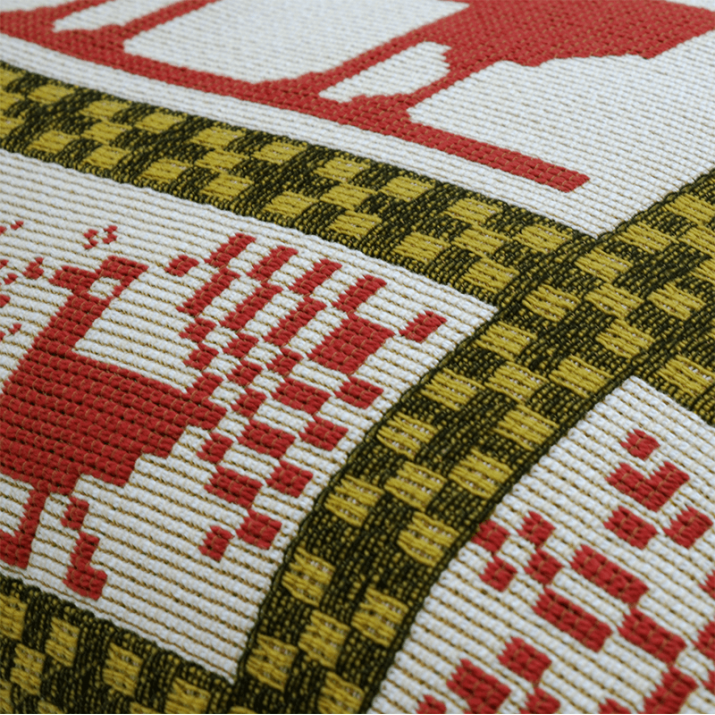 Detail of Red manitoba cushion Jules Pansu - jacquard textile, mountain, winter, rendeer